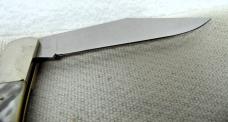 1985 PEARL 5" COKE BOTTLE FOLDING KABAR USA MINT COLLECTORS CLUB KNIFE HAS MAN FIGHTS BEAR SHIELD 