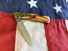 Case xx 1984 Medium Lockback (mdl# 059L SS) w/ American Flag & Eagle Soaring Synthetic Handles -NOS