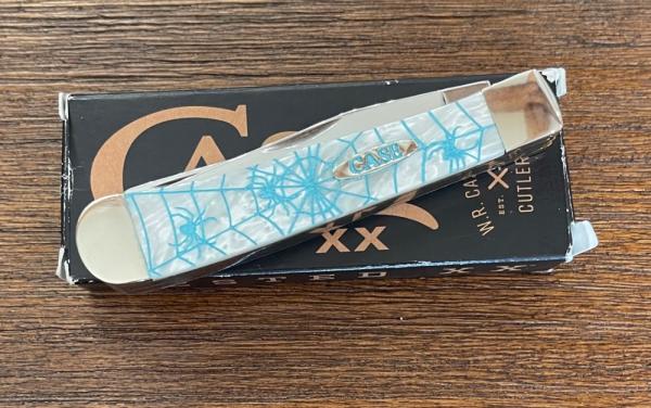 Case #06073 White Trapper with Aqua spider etching. 