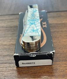 Case #06073 White Trapper with Aqua spider etching. 