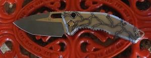 HERETIC MEDUSA AUTO TANTO BATTLE WORN BRONZE W/FLAMED TITANIUM HANDLES.