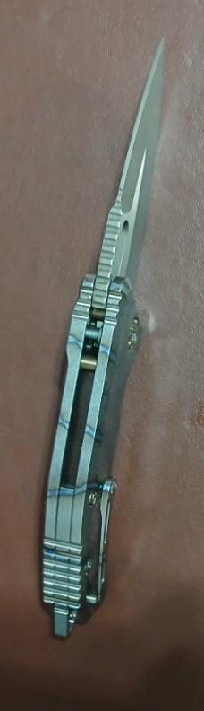 HERETIC MEDUSA AUTO TANTO BATTLE WORN BRONZE W/FLAMED TITANIUM HANDLES.