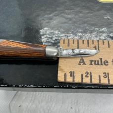 Antique imperial or hammer brand tiny 2 blade Jack knife with a tigers eys design handles 