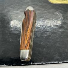 Antique imperial or hammer brand tiny 2 blade Jack knife with a tigers eys design handles 