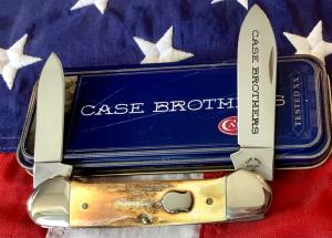 2004 Case xx Canoe w Great Burnt Stag Handles mdl 52131 SS NOS in Orig tin plus carrying pouch