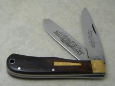Remington USA R1128 2007 25th Anniversary Cocobola Bullet Trapper Knife in Tin