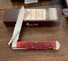 Schatt & Morgan swing guard lockback with red worm grooved bone handles FW4121L-2