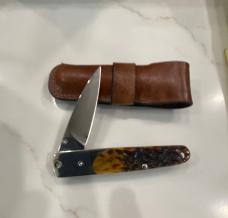 Case 2012 Amber bone Slimlock like new in with original sheath. Sorry no box