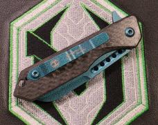 Heretic Jinn Button Lock Flipper Metallic Teal MagnaCut Carbon Fiber Handles