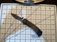 Buck 112 Ranger Sport Folding Knife 3" S35 plain Blade, Black Aluminum Handles with Green Micarta I
