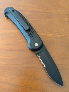 HUBERTUS TACTICAL Z2001 BLACK ON BLACK SERRATED DROP POINT BLADE ZYTEL POLYMER SCALES COIL SPRING