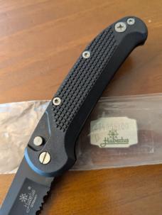 HUBERTUS TACTICAL Z2001 BLACK ON BLACK SERRATED DROP POINT BLADE ZYTEL POLYMER SCALES COIL SPRING