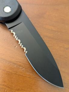 HUBERTUS TACTICAL Z2001 BLACK ON BLACK SERRATED DROP POINT BLADE ZYTEL POLYMER SCALES COIL SPRING