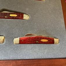 Case xx, One of 500, Dark Red Bone Set w/ Dark Red Bone Handles +Gold Shield & Scrolled Bolsters