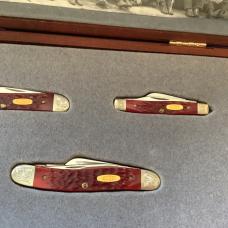 Case xx, One of 500, Dark Red Bone Set w/ Dark Red Bone Handles +Gold Shield & Scrolled Bolsters