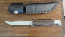 BUCK 102GRS1-B Woodsman Pro with Micarta handle. Discontinued 
