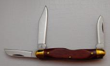 Camillus In Near Mint Condition With Wood Synthetic Covers 3 1/4