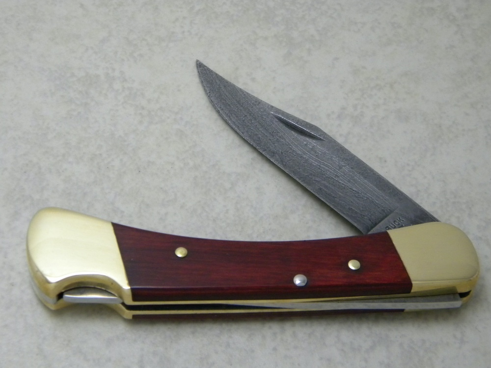 Buck USA Designer's Choice Model 110 Wood & Damascus Folding Buck USA Designer's Choice Model 110 Wood & Damascus Folding
