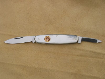H. Boker &amp; Co's Improved Cutlery. Has an old (circa. 1908) Cadillac emblem as a shield.