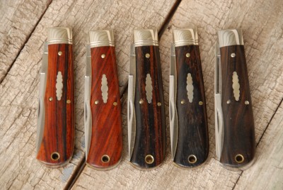 So here are a number of Cocobolo knives...the two from the left are what is typically thought of while the second and third from the right were labeled as Dark Cocobolo..and the far right is Ebony for comparison.