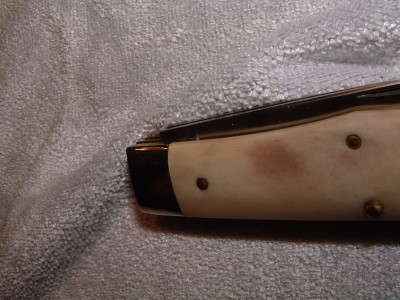 Tiny hairline above pin, barely visible in photo.