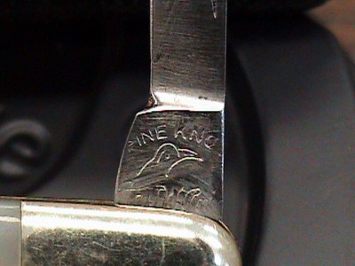 The writing on the blade says Irv W Price I think