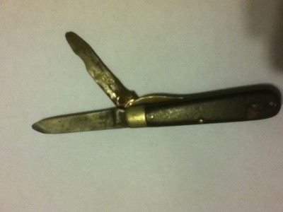 Pretty sure this one is beyond repair. There is no lock on the second blade so it folds completely backward. The corrosion makes it too difficult to see the name.