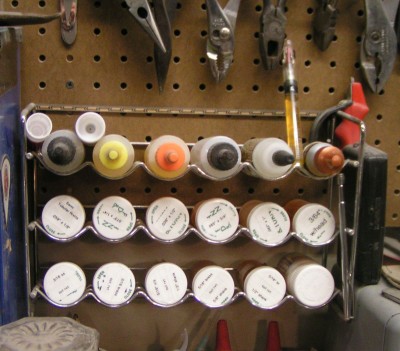 Factory pins in an old spice rack.jpg