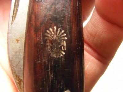 on the wood(I don't know the type of wood) handle