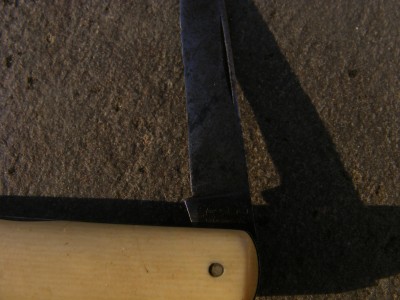 Best I can tell it is REMINGTON block in circle,MADE IN USA around