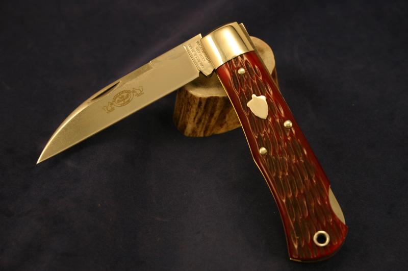 #720111 Jigged Ruby Red Bone Lockback (a).jpg