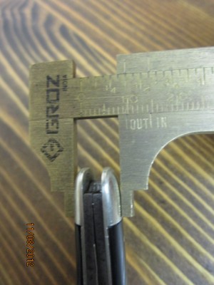 tipping the micrometer at roughly 3/8" on the master blade end