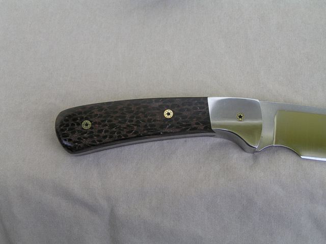 Black Palm End grain Click on the pic, some reason it looks distorted. This one is dovetailed, I do it with all knives that have a bolster now, except if I make a scroll shape bolster.