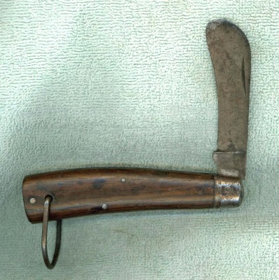 A Schrade Cut Co with a Rosewood or Cocobolo handle. (Cocobolo is a type of Rosewood)