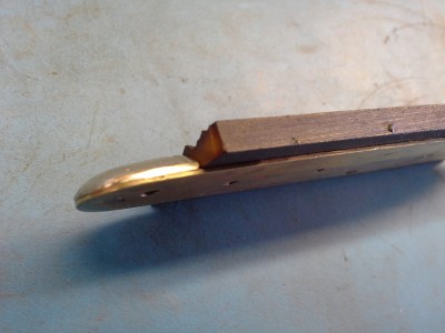 You can start to see the amber/bone color on the sanded portion.