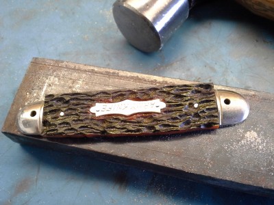 Pins peened, handle and shield attached.
