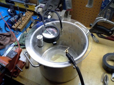 This was my first chamber. I used vinyl tubing split in half around the edge of the pot for the seal. Where the PVC fittings are I had an check valve that I bought from home depot. I couldn't create enough vacuum to move the check valve so that idea was out. I just put in a standard valve.