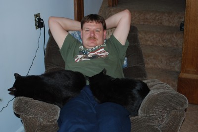 Two black cats keeping me warm.JPG