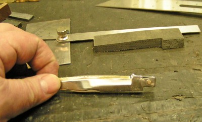 2- tapered brass spacer to keep blade tangs parallel.jpg
