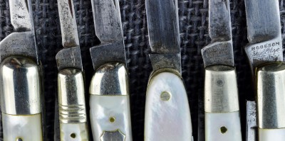 The one in the middle that is hard to make out the tang stamp is a H. Boker.