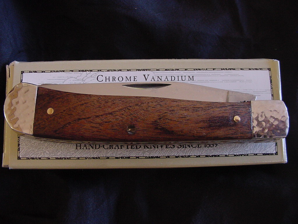 Custom case with Mesquite scales and hammered bolsters