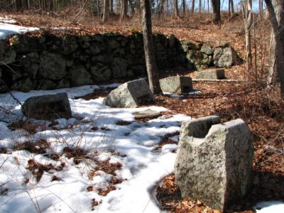 The old stones with mortise (Hand cut?) to accept foot of anvil for hand forging.