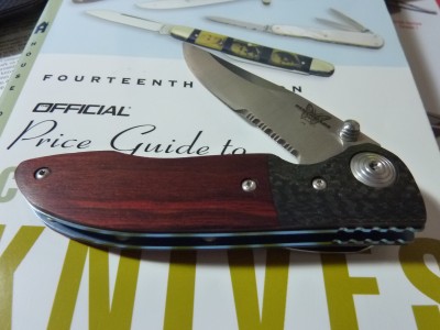 Benchmade with Blue Titanium frame, Rosewood Handle and Carbon Fiber bolster.