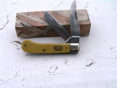 2005 Bulldog Saddlehorn with Waterfall celluloid handles. Breaking down Already! Fingerprints show readily because of lube on the blades. Double click to see the shield and bolster