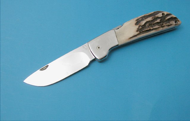 # 1 Mint - Stag handmade folder by the late Knifemakers Guild member Norm Levine, front lock, stag handles