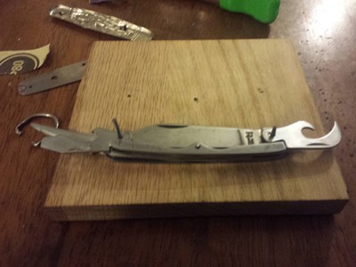 Here, I started to shed each layer to show my predicament.  As seen in this less than decent photo, while one tool can be positioned the other is almost half covered by the spring.