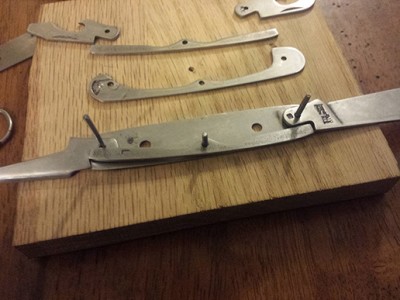 This last picture displays my biggest worry.  I have enough trouble setting the pins as is, but the thin tang to the poker opposite the knife makes it hard to keep any purchase on the backspring as I try to set it.  Needless to say I have a few new small cuts from slipping.