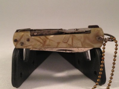 only 2 1/4" long (closed) - could it be Military?