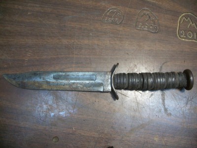 Before: blunt, pitted, ground, bent guard, handle shot.,