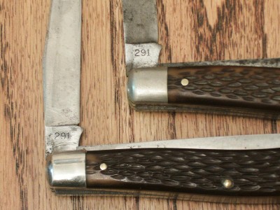 PAIR OF SCHRADE 291 TRAPPERS - PILE SIDE WITH MODEL #.JPG